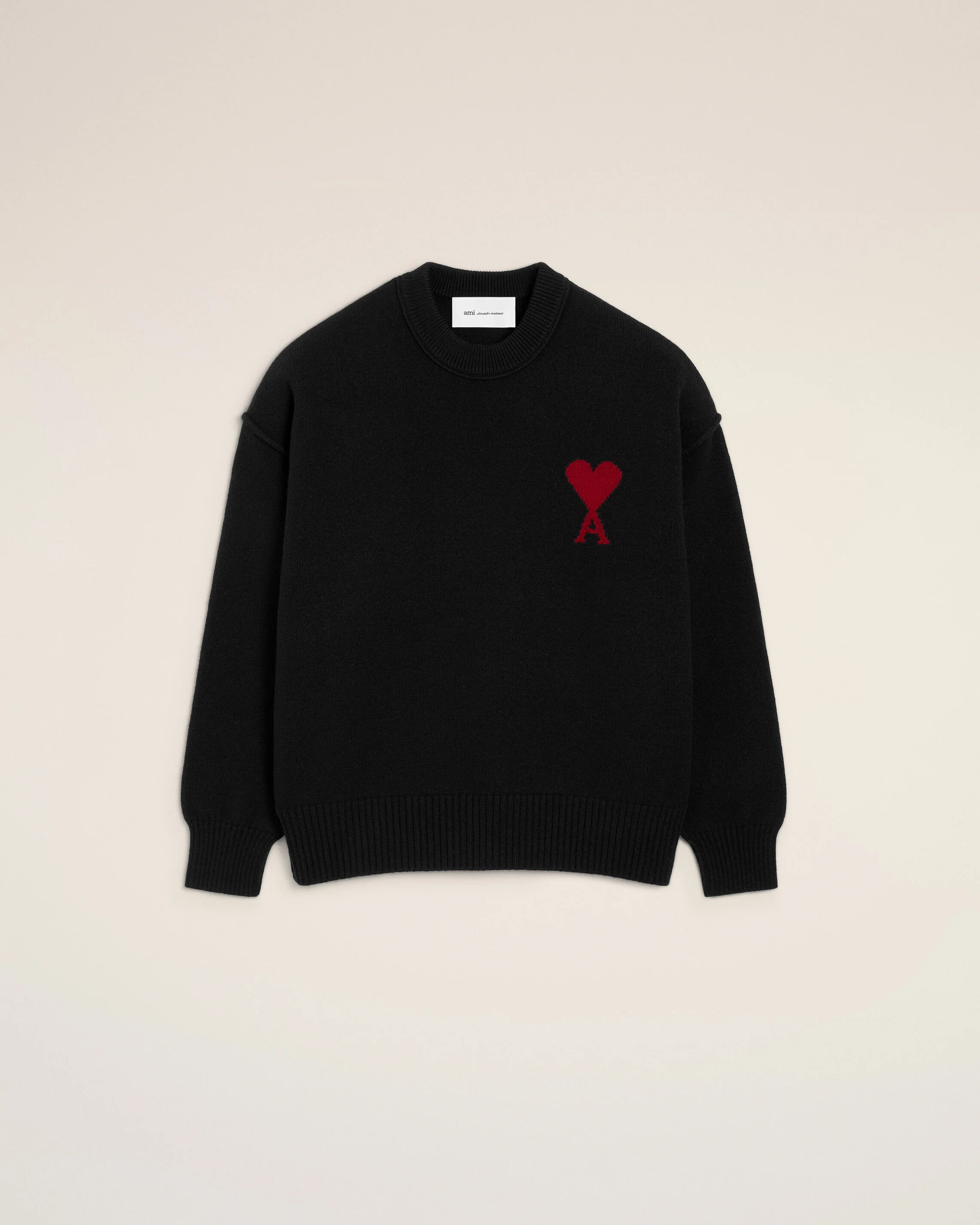 black wool crewneck sweater with contrasted ami de coeur