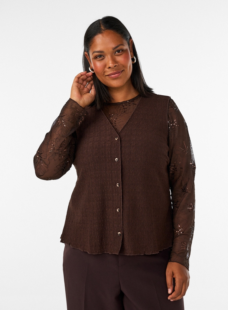 meshbluse med blomster og pailletter